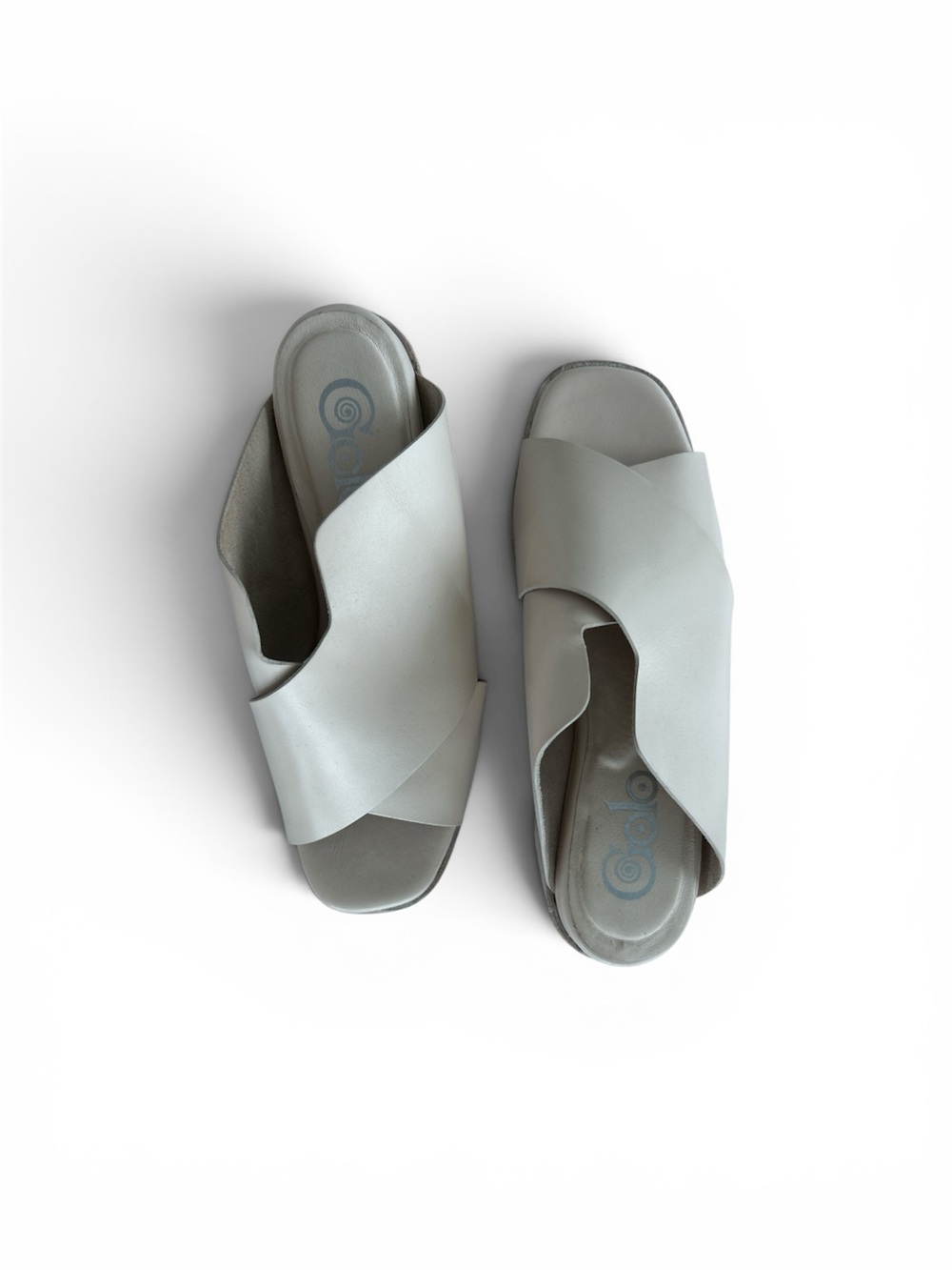 Golo brand wedge sandals cream leather crossover straps on a wooden wedge heel